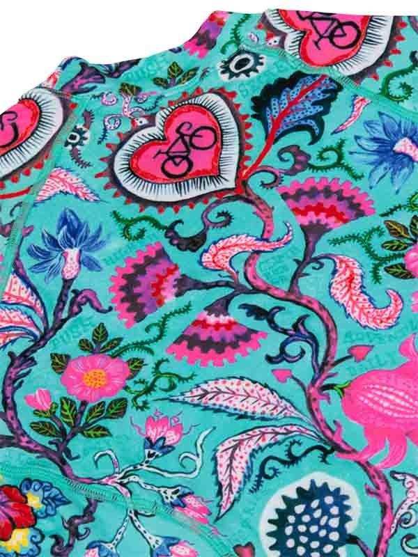 Vibrant cycling jersey with floral and heart-bicycle print on teal fabric, ideal for women's bike wear.