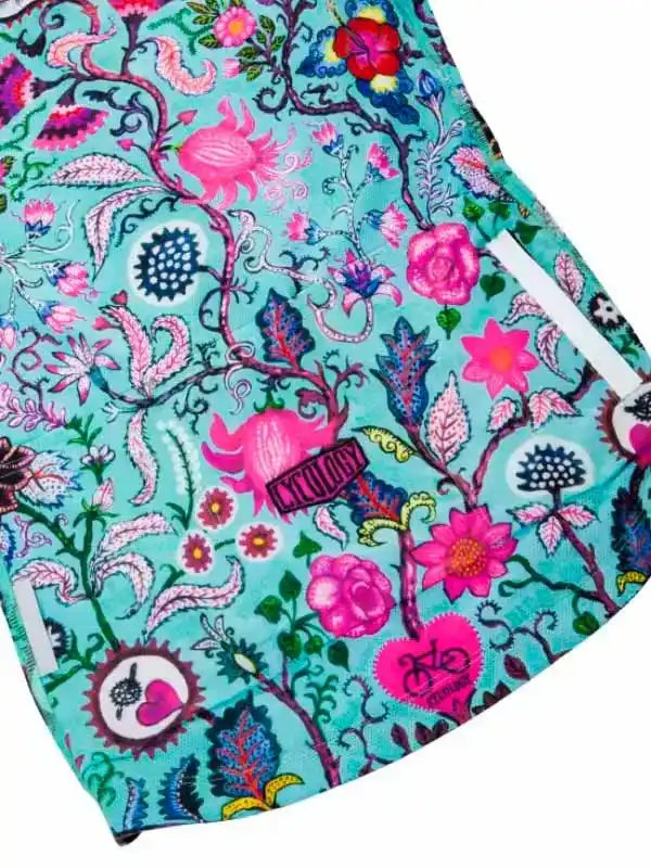 Vibrant floral cycling shorts with pink and teal botanical print, ideal for women's bike rides.