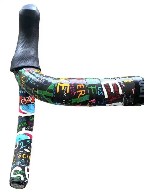 Colorful graffiti-style cycling handlebar tape with bold lettering and bike icons, ideal for road bikes.
