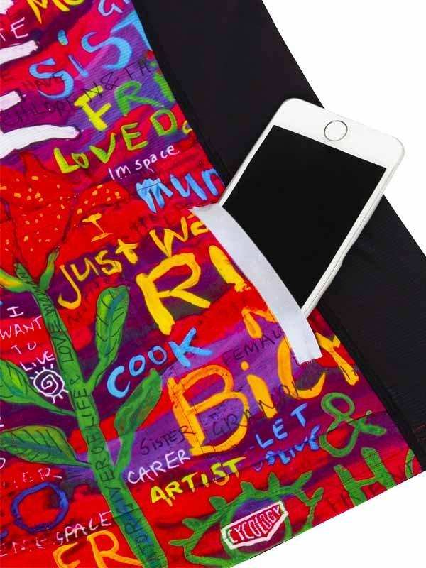 Colorful cycling jersey pocket holding phone, vibrant graffiti-style design with bold text and art