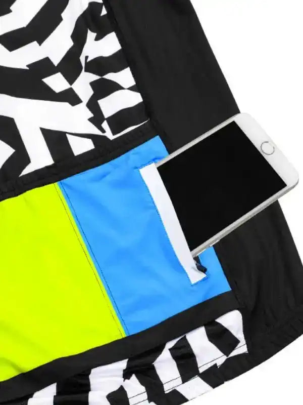 Cycling jersey with bold black-white pattern, neon yellow and blue panels, and phone pocket