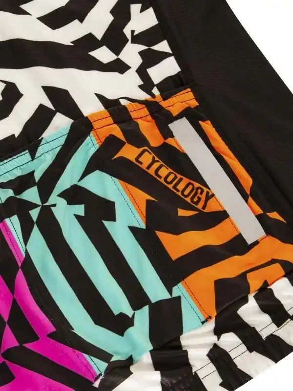 Colorful geometric cycling shorts with bold black, orange, teal, and pink patterns for men and women