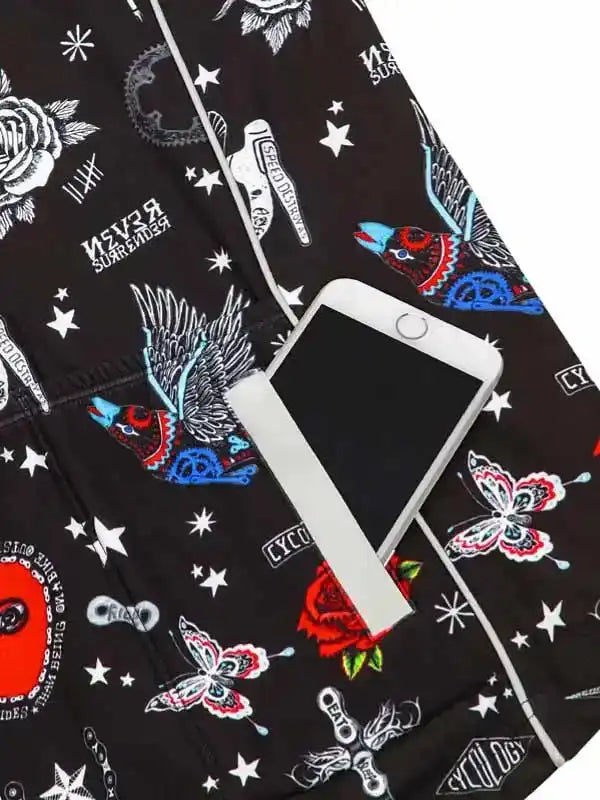 Black cycling shorts with colorful bird, butterfly, and star print, featuring phone pocket
