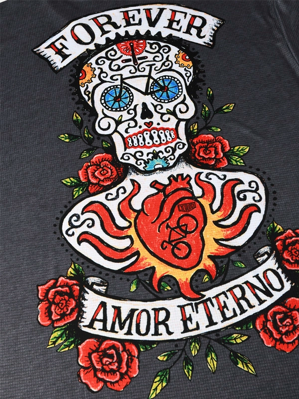 Embroidered design on a garment with a skull, heart, and roses, featuring the text 'Forever Amor Eterno'.