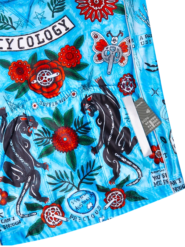 Colorful close up of back pockets with panther designs, flowers, and text on a blue background