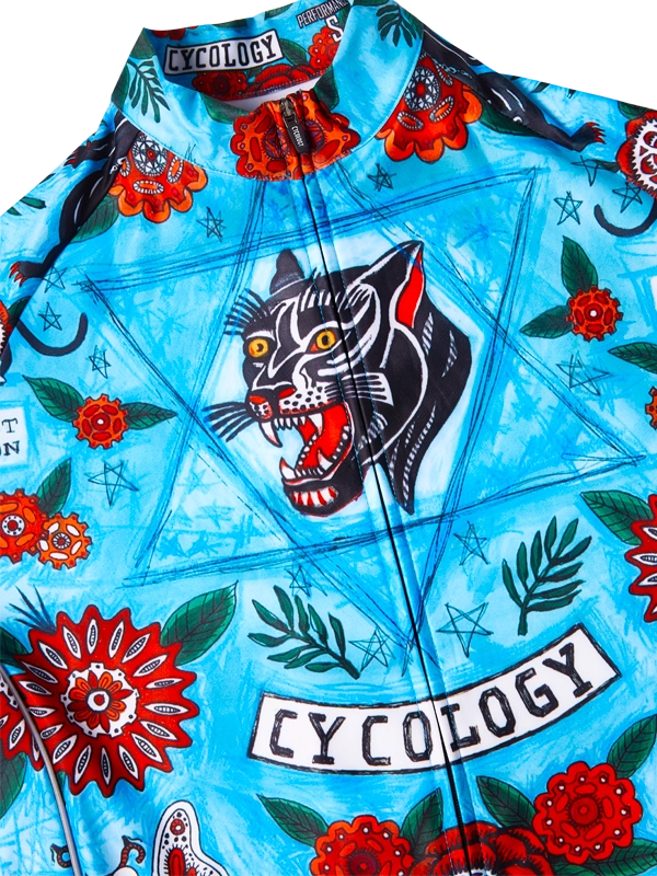 Colorful cycling winter jersey with a tiger design and 'Cycology' branding on a blue background