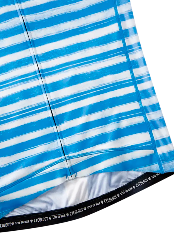 Close-up of blue and white striped fabric with a brand logo at the bottom.
