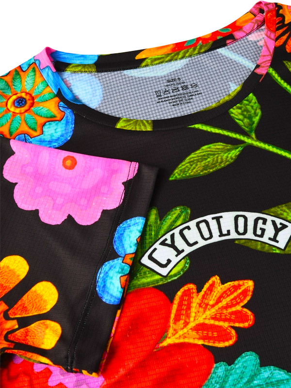 Colorful floral-patterned garment with 'Cycology' branding on a black background