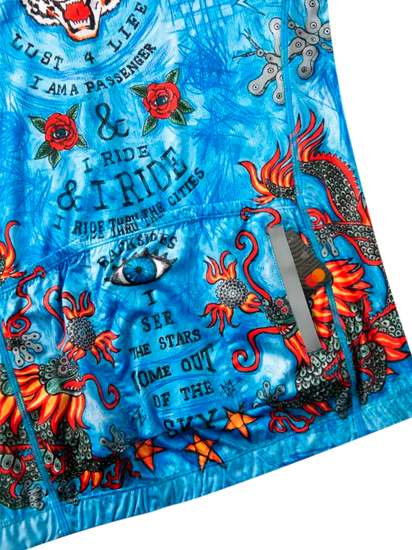 Blue cycling jersey with tattoos and text design, featuring the brand 'Cycology'.