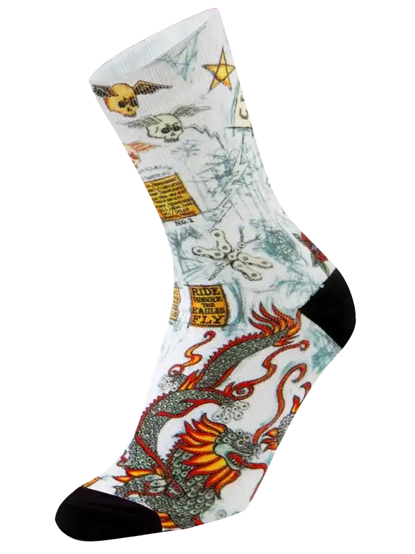 Men's cycling socks with dragon, skulls, and stars design on white background