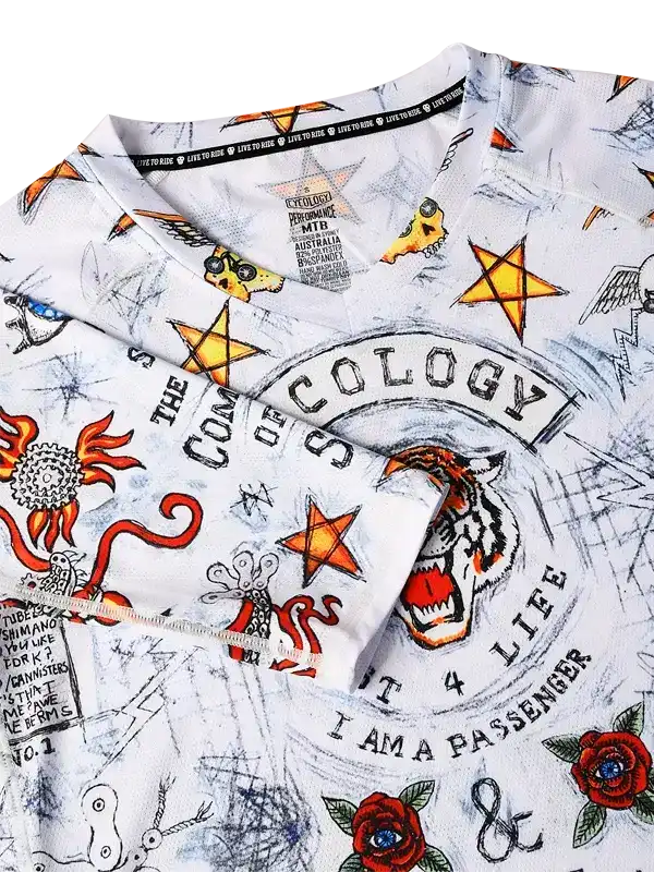 Men's cycling jersey with bold tiger, stars, and roses graphic print on white fabric