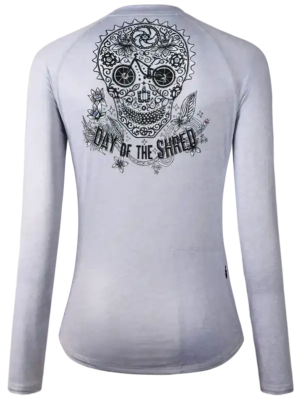 Women's cycling jersey with sugar skull and 'Day of the Shred' graphic, long sleeve, light gray