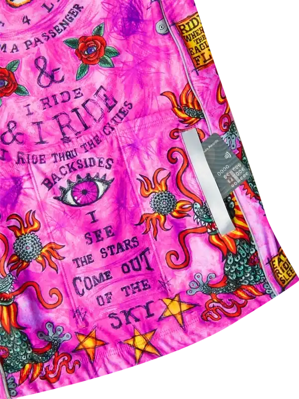 Vibrant pink cycling jersey with bold graphics, roses, stars, and cycling phrases for urban riders.