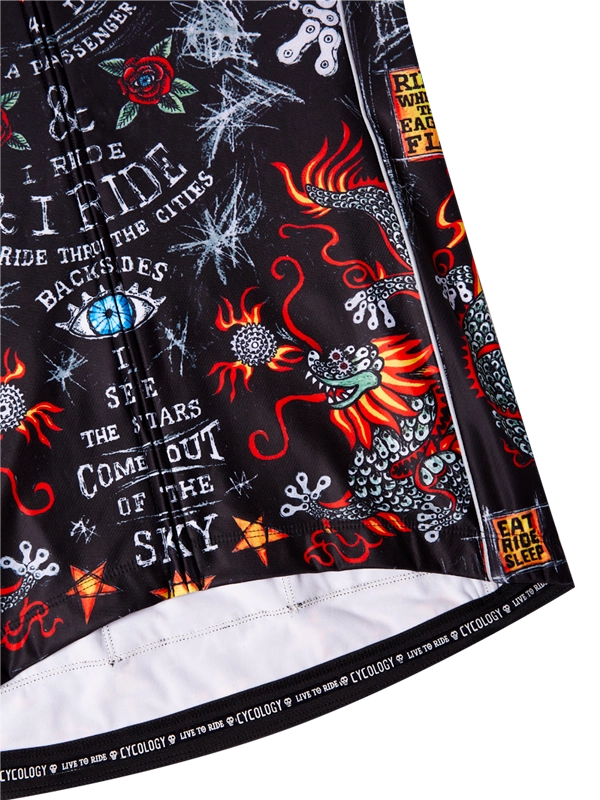 Close-up of a black cycling jersey with colorful designs and text.