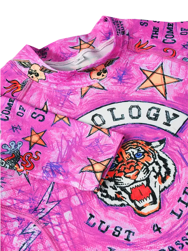 Pink long-sleeve cycling base layer  with tiger design and colorful graphics and text 
