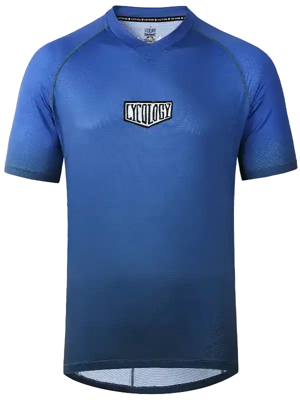 Blue men's cycling jersey with breathable fabric and logo, designed for performance and comfort on rides.