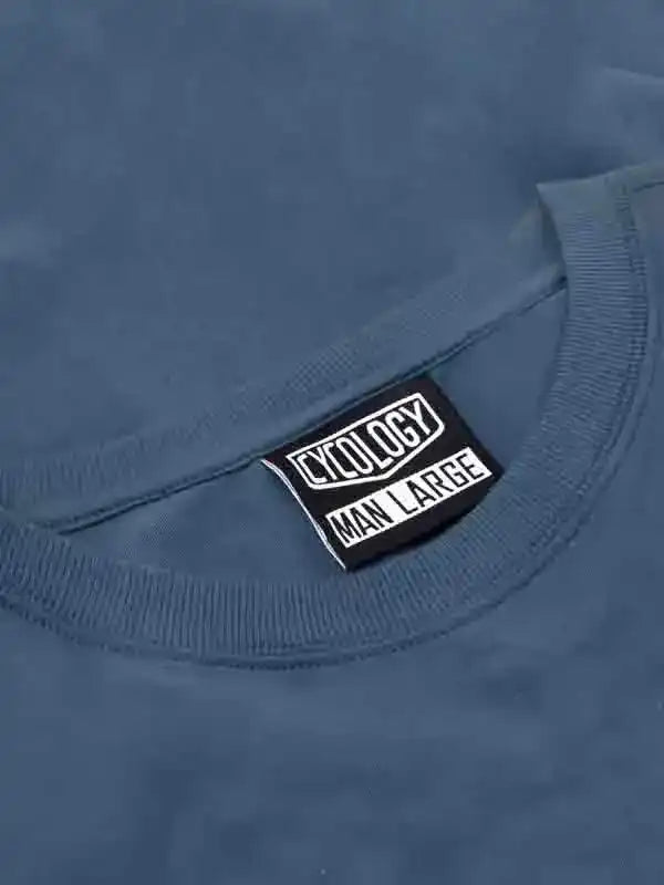 Blue men's cycling t-shirt with Cycology brand tag, size large, soft fabric detail