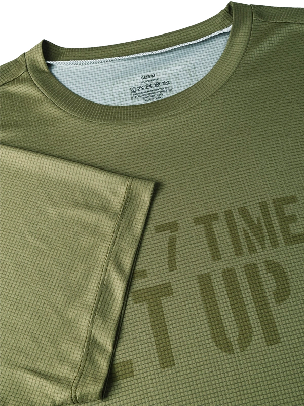 Green athletic shirt with text