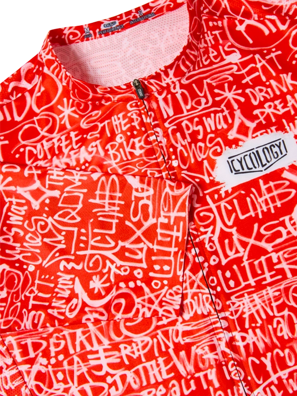 Red men's short sleeve cycling jersey neck close up with white text pattern  