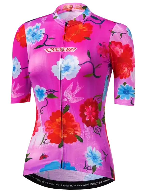 Women's pink floral cycling jersey with swallow print, short sleeves, full zip front, performance fabric