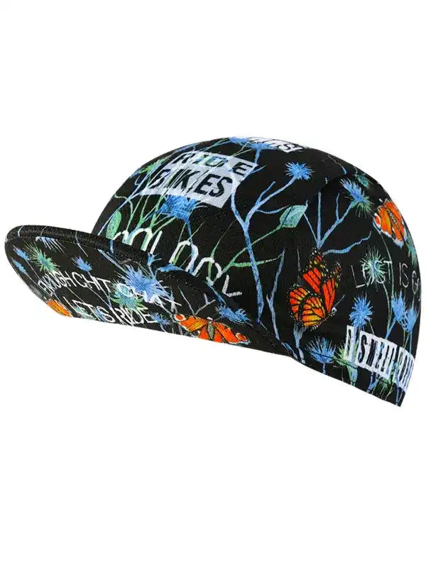 Black cycling cap with butterfly and floral print, featuring 'RIDE BIKES' text for bike enthusiasts.