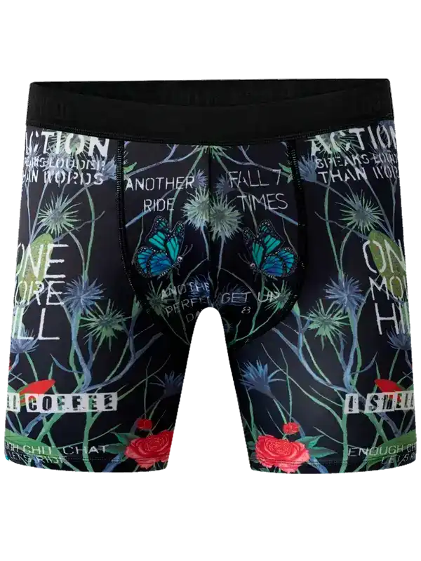Men's cycling shorts with floral and butterfly print, motivational text, black waistband