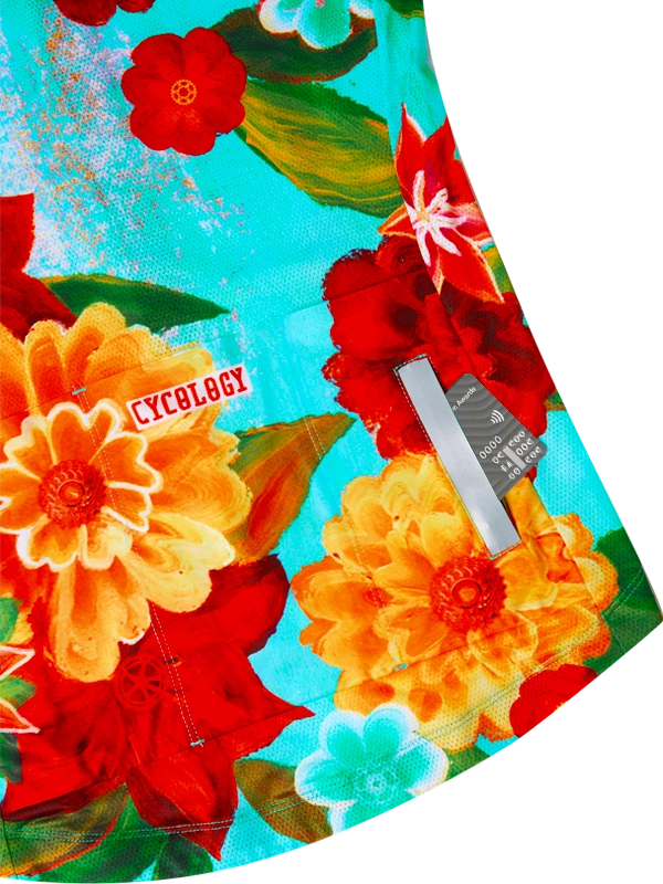 Colorful women's floral-patterned cycling jersey with 'Cycology' branding on back pockets