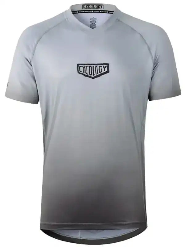 Men's gray gradient cycling jersey with Cycology logo, performance fabric, short sleeves, V-neck