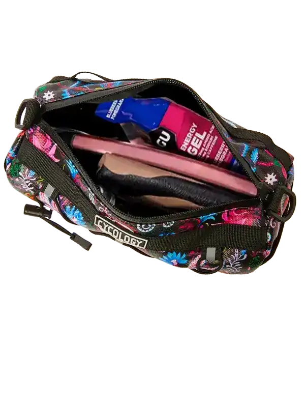 Cycology floral bike bag with energy gel and phone inside, perfect for cycling adventures