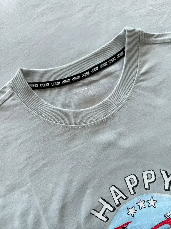 Light gray cycling t-shirt with 'HAPPY' graphic and branded neck tape, ideal for men's and women's bike rides.