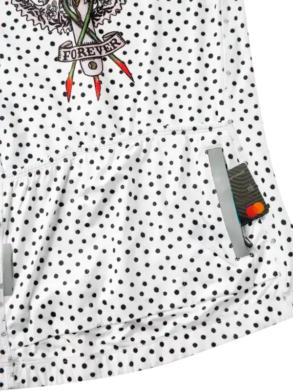 White polka dot cycling jersey with 'FOREVER' floral graphic and rear pockets for storage