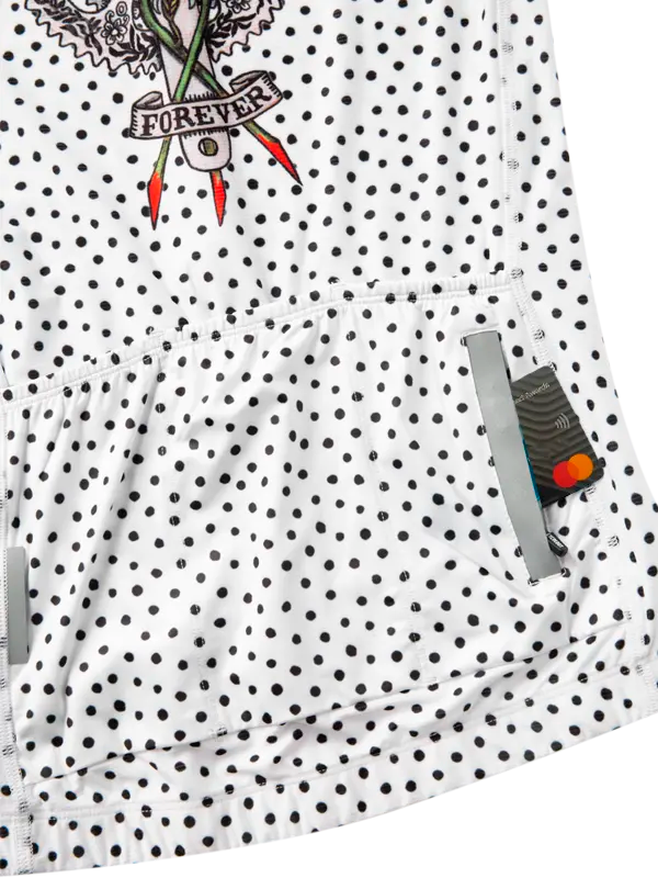 White shirt with black polka dots and a tattoo-style graphic on a white background