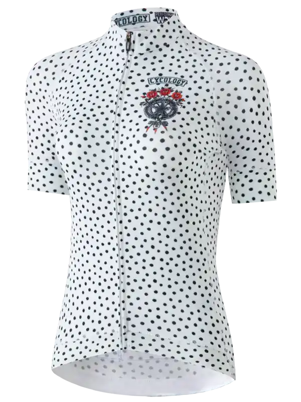 White women's cycling jersey with black polka dots and skull graphic, full zip front