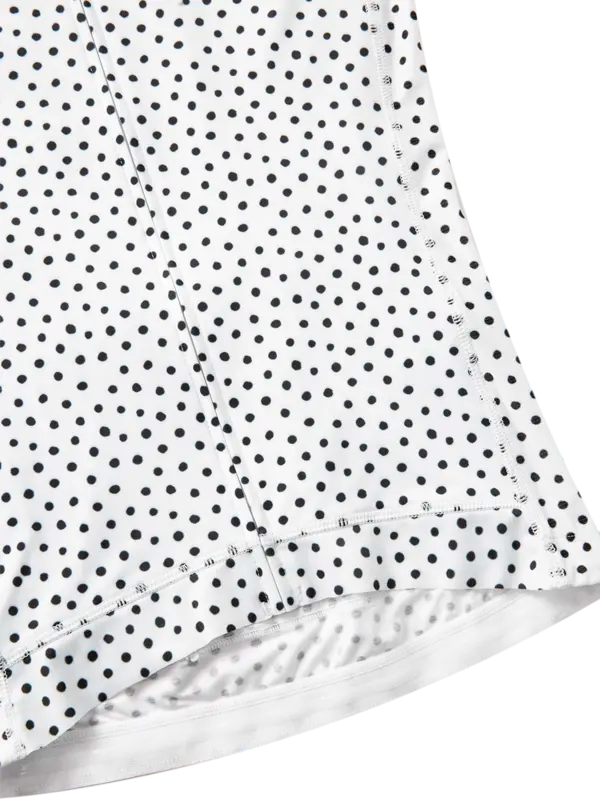 Close-up of a white fabric with black polka dot pattern
