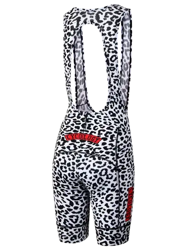 Women's cycling bib shorts with black and white leopard print, red logo, and ergonomic design