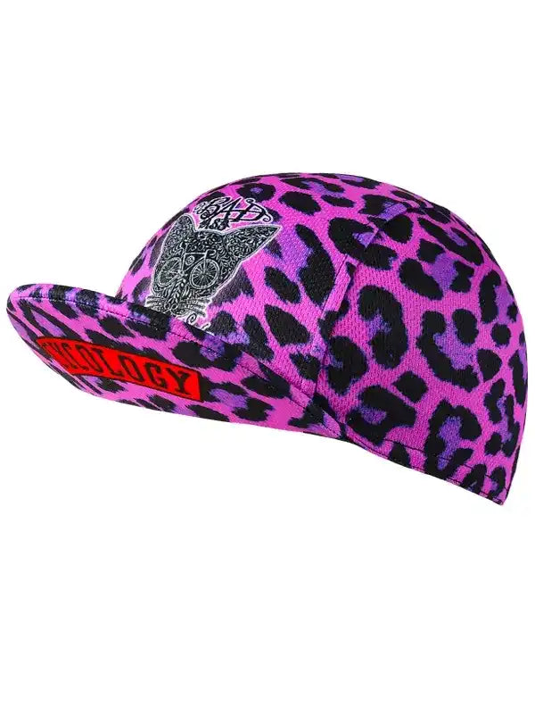 Pink leopard print cycling cap with skull design and red logo, stylish bike accessory for riders