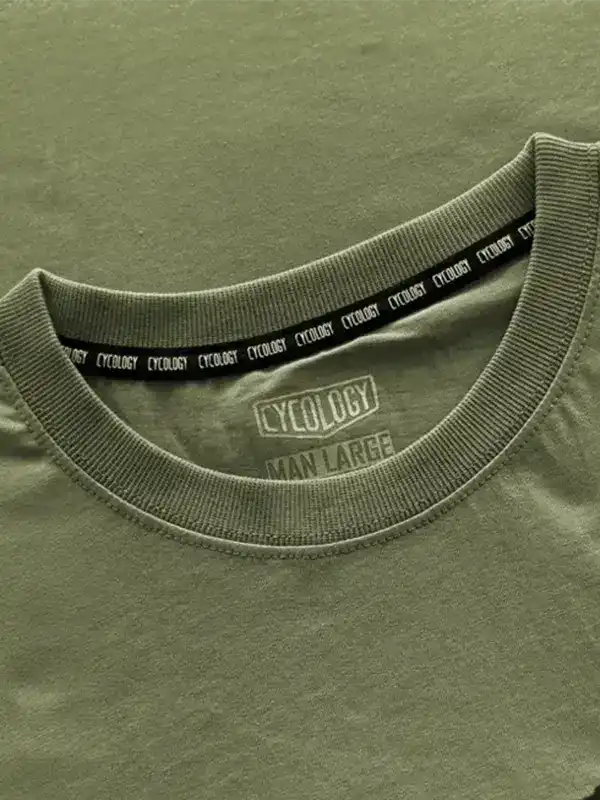 Olive green men's cycling t-shirt with branded neck tape and size label, soft fabric detail
