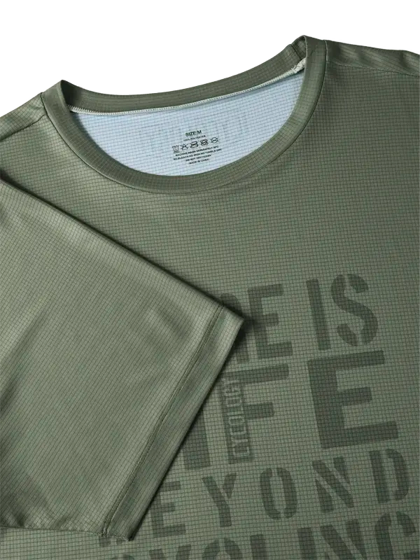 Green t-shirt with text 'There is life beyond cycling, said no cyclist ever' 