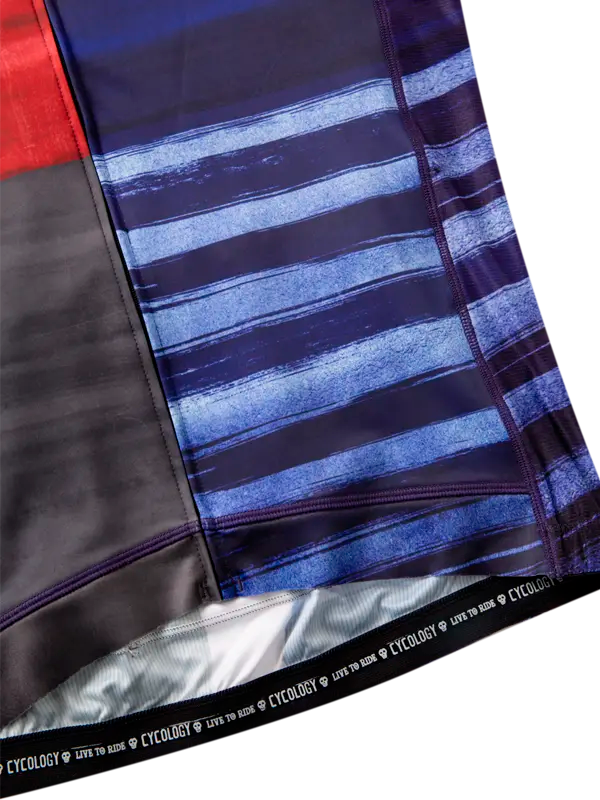 Close-up of fabric with blue and black striped pattern, featuring the brand 'Cycology'.