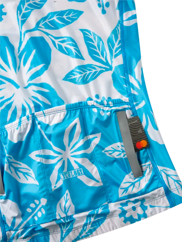 Blue cycling jersey with white floral pattern on a white background back pockets