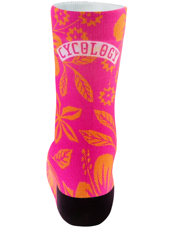 Colorful sock with pink floral pattern on an orange background
