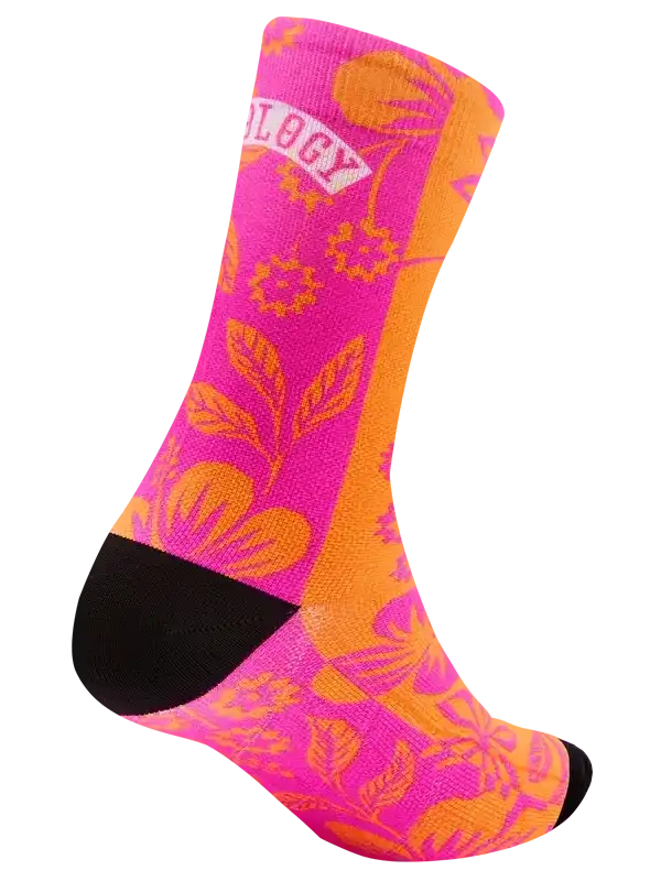 Bright pink and orange floral cycling sock with black toe and heel, featuring bold botanical print for active rides.