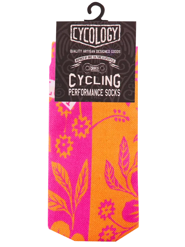 Colorful sock with pink floral pattern on an orange background