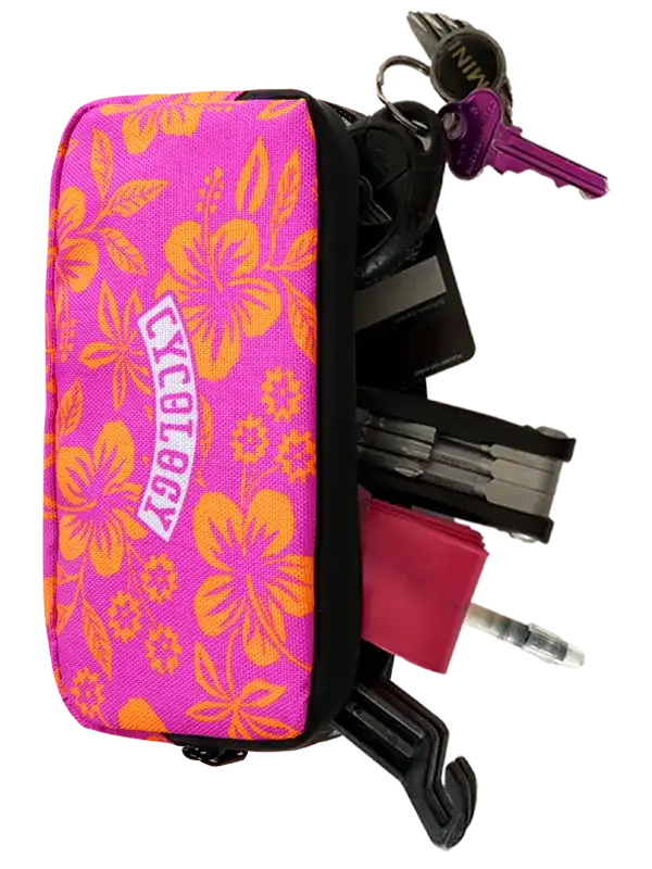Cycology Clothing Oahu cycling wallet in pink with orange floral print and keys attached.