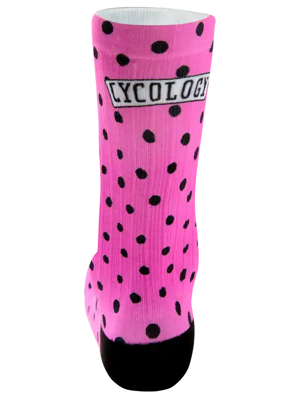 Pink cycling sock with black polka dots and 'CYCOLOGY' logo, designed for men's and women's bike rides