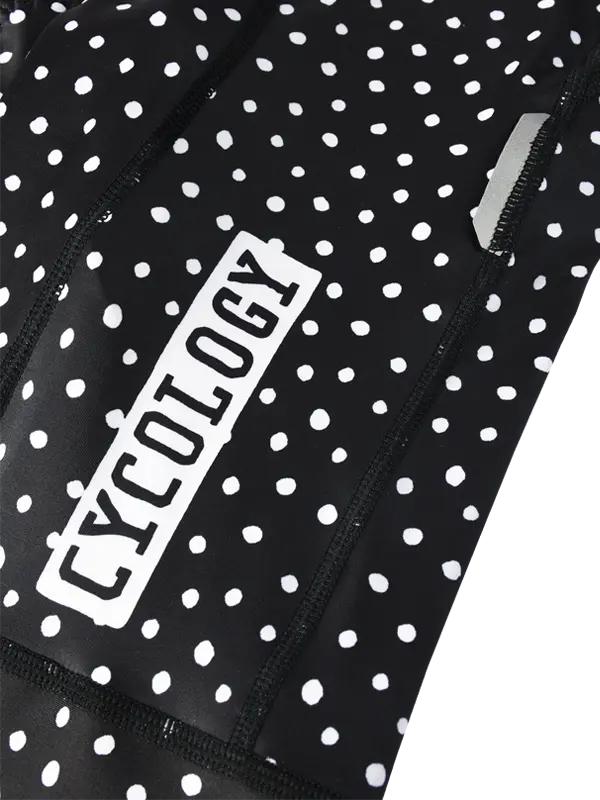 Black athletic outfit with white polka dots and 'Cycology' branding.