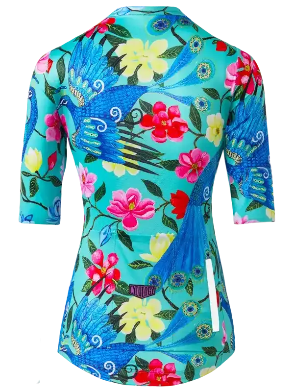 Women's cycling jersey with vibrant peacock and floral print on teal background, 3/4 sleeves