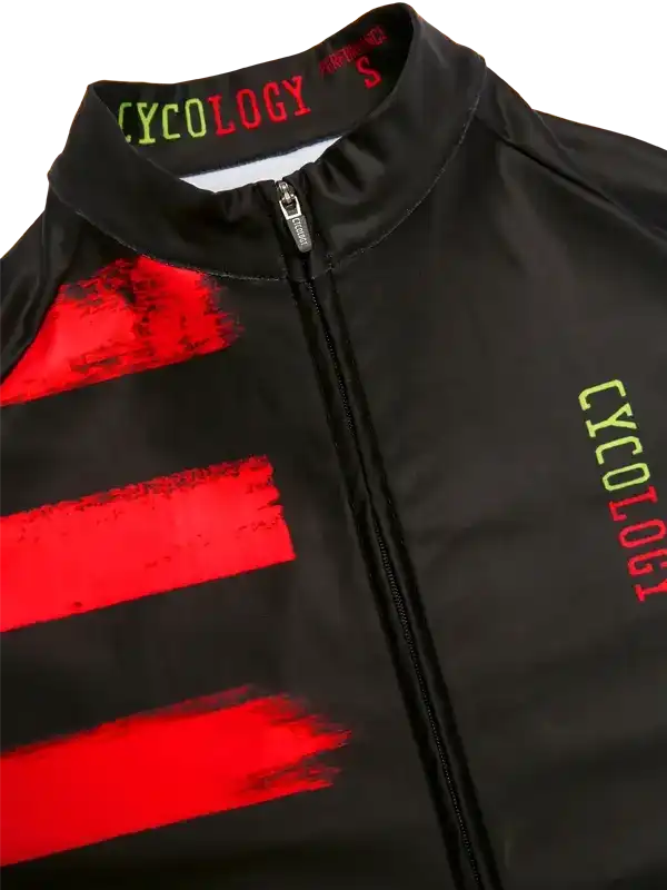 Black cycling jersey with bold red stripes and neon green 'CYCOLOGY' branding, zippered front design