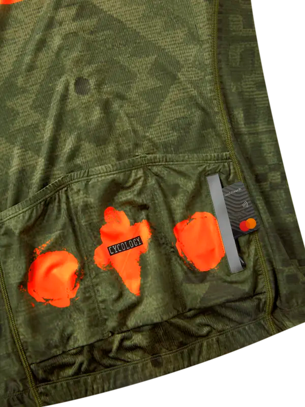 Green cycling jersey with orange stripe  and back pockets
