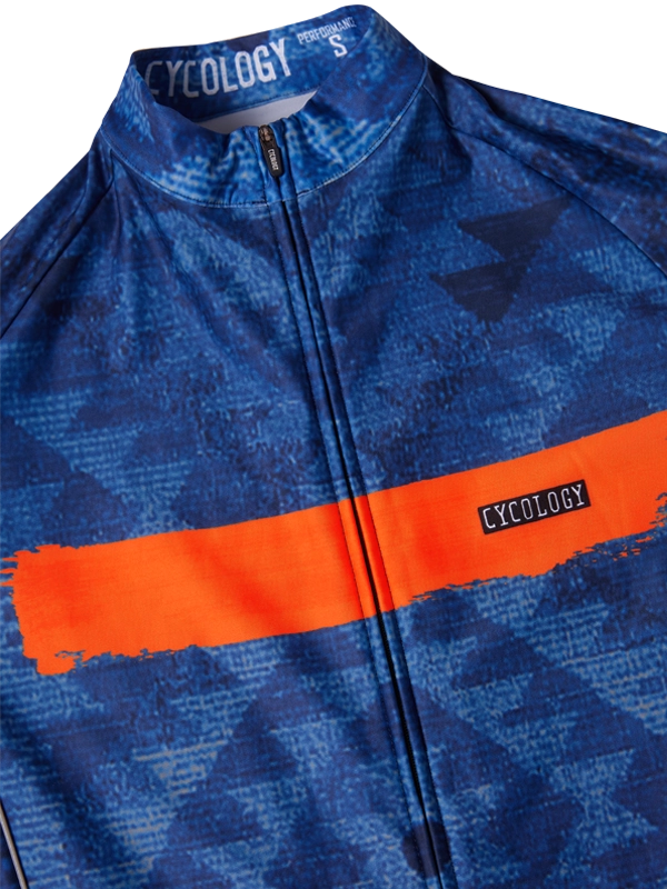 Blue cycling jersey with orange stripe and 'Cycology' branding